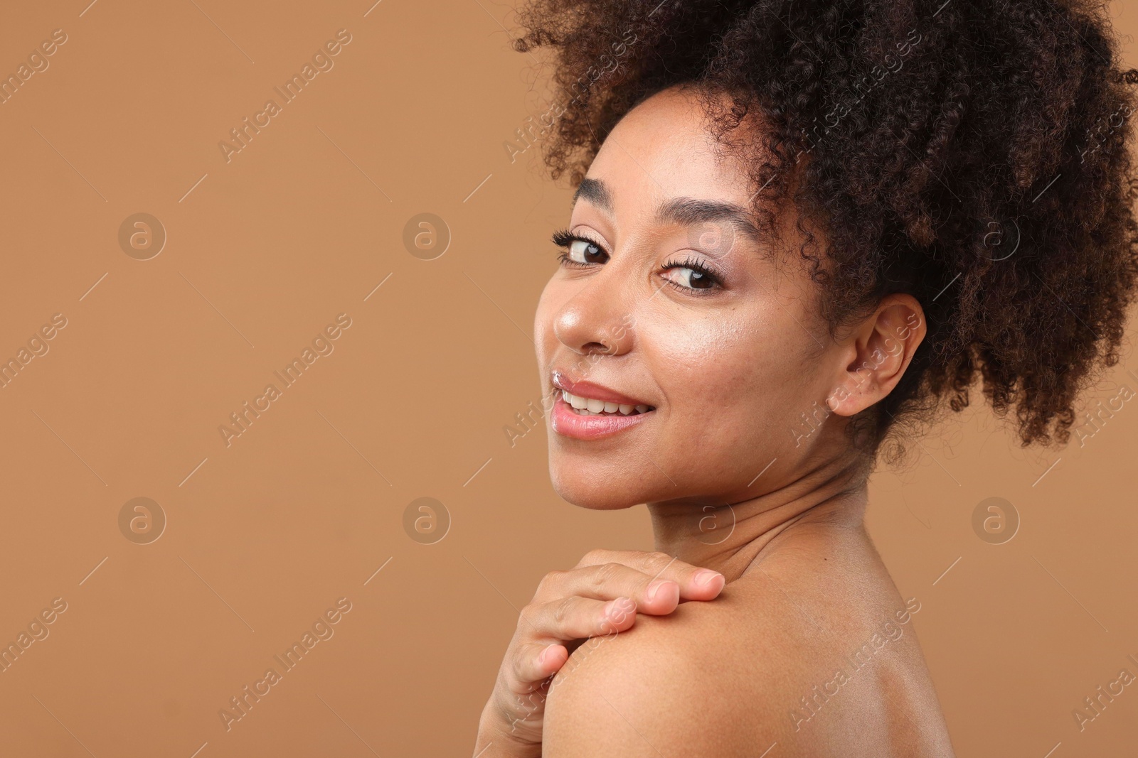 Portrait of beautiful Brazilian woman after spa treatment on light brown background. Space for text Photo of Portrait of beautiful Brazilian woman after spa treatment on light brown background. Space for text