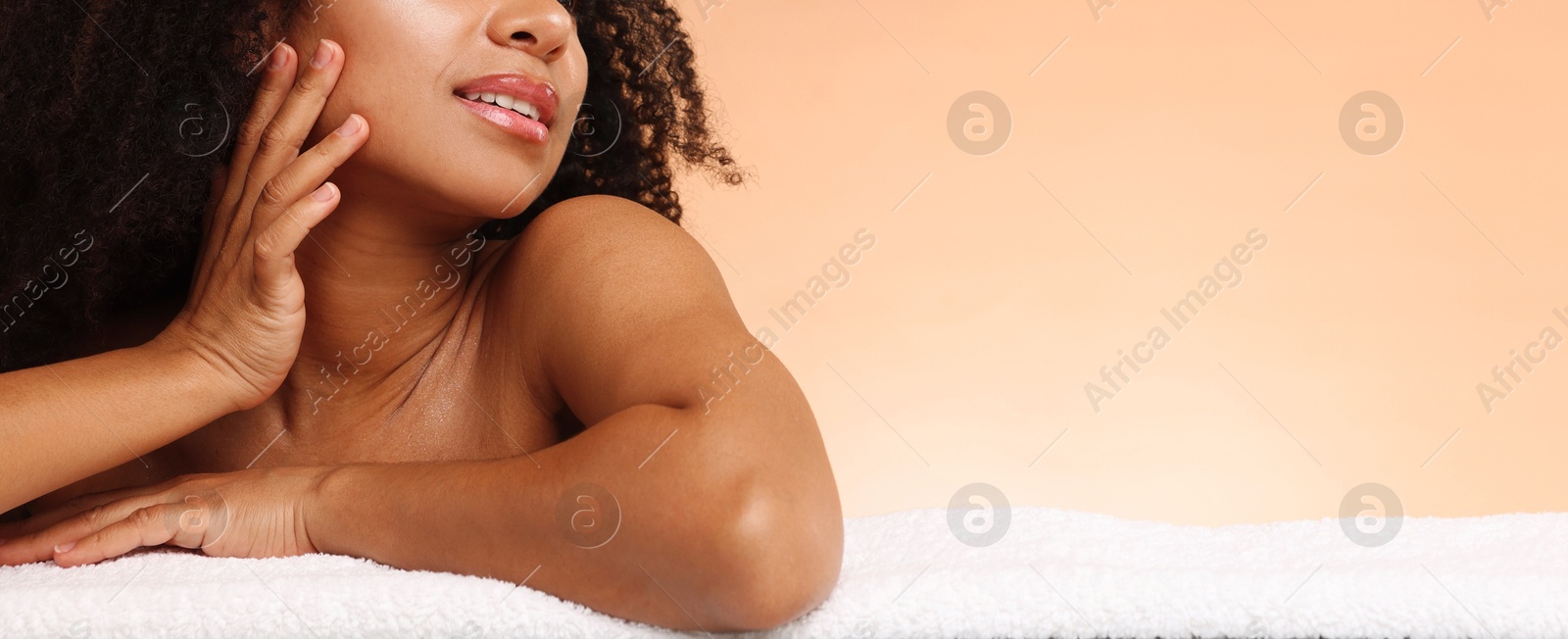 Brazilian woman after spa treatment on beige gradient background, closeup. Space for text Photo of Brazilian woman after spa treatment on beige gradient background, closeup. Space for text