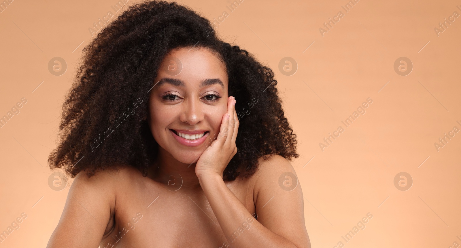 Portrait of beautiful Brazilian woman after spa treatment on beige background. Space for text Photo of Portrait of beautiful Brazilian woman after spa treatment on beige background. Space for text