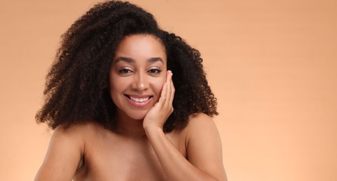 Photo of Portrait of beautiful Brazilian woman after spa treatment on beige background. Space for text