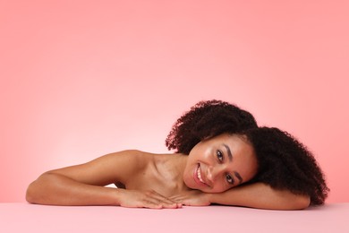Photo of Portrait of beautiful Brazilian woman after spa treatment on pink gradient background