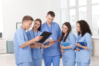Photo of Group of medical students in uniforms indoors
