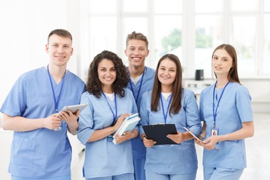 Photo of Group of medical students in uniforms indoors
