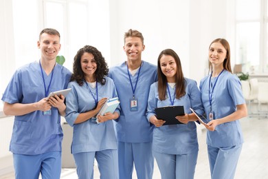 Photo of Group of medical students in uniforms indoors