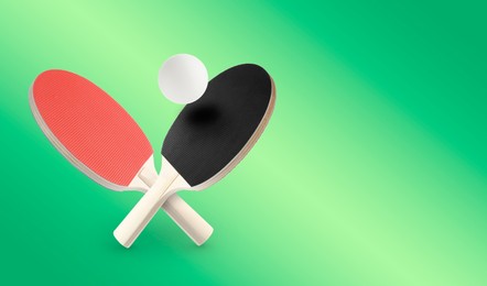 Image of Ping pong rackets and ball in air against green gradient background. Banner design with space for text