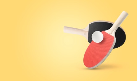 Image of Ping pong rackets and ball in air against pale orange background. Banner design with space for text
