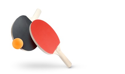 Image of Ping pong rackets and ball in air against white background