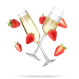 Image of Sparkling wine in flute glasses and fresh strawberries falling against white background
