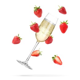 Image of Sparkling wine in glass and fresh strawberries falling against white background