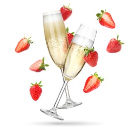Image of Sparkling wine in flute glasses and fresh strawberries falling against white background