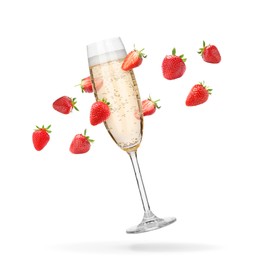 Image of Sparkling wine in flute glass and fresh strawberries falling against white background