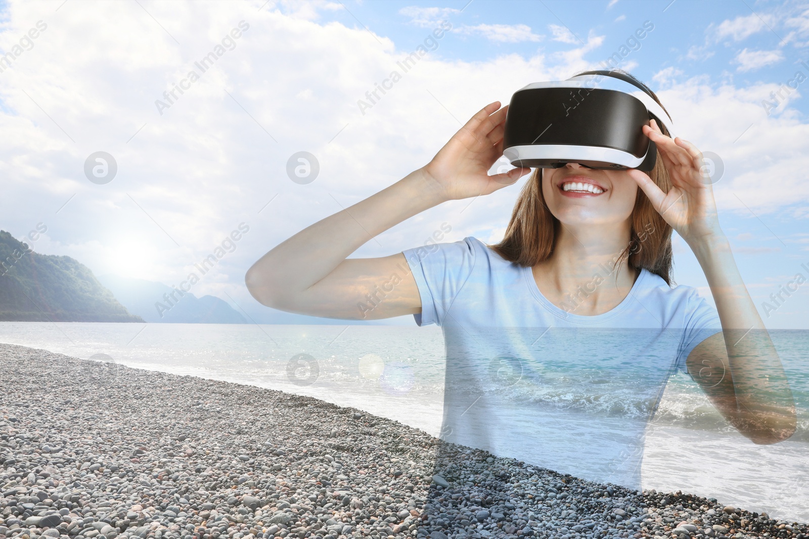 Happy woman using virtual reality headset, double exposure with seascape Image of Happy woman using virtual reality headset, double exposure with seascape