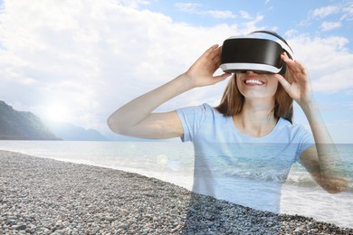 Image of Happy woman using virtual reality headset, double exposure with seascape