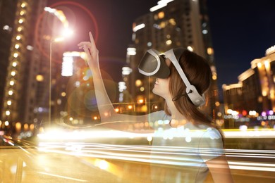 Image of Happy woman using virtual reality headset, multiple exposure with cityscapes