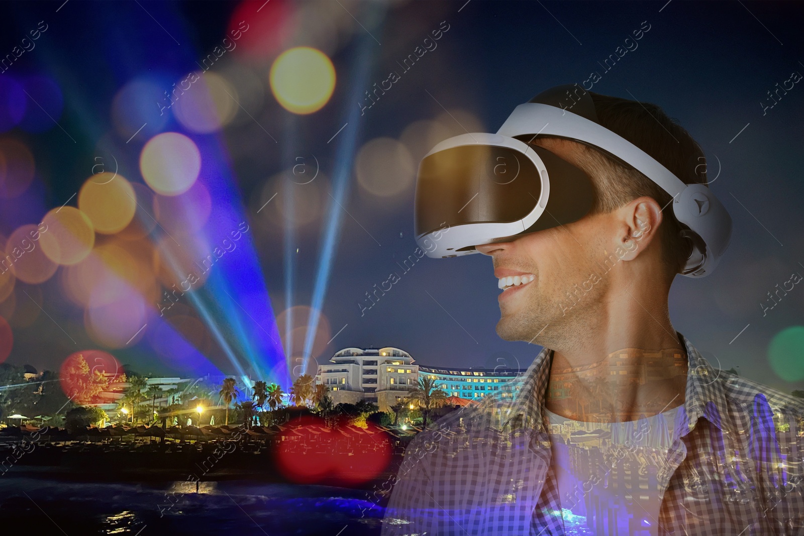 Happy man using virtual reality headset, double exposure with cityscape Image of Happy man using virtual reality headset, double exposure with cityscape