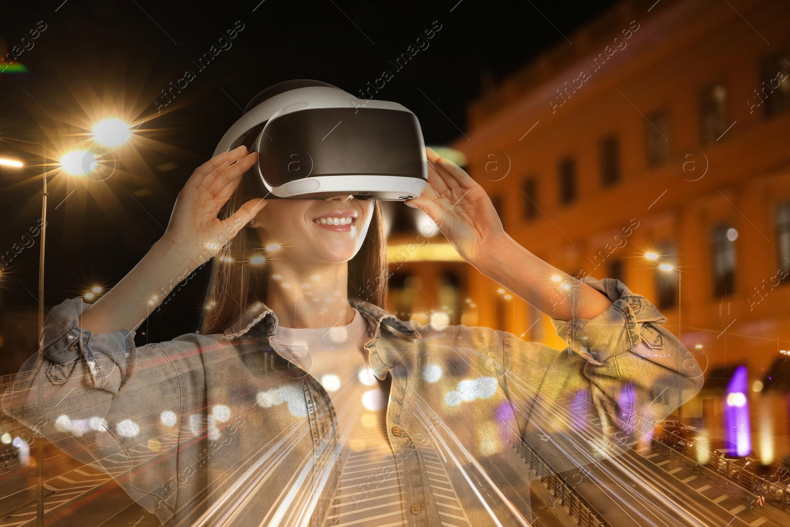 Happy woman using virtual reality headset, multiple exposure with cityscapes Image of Happy woman using virtual reality headset, multiple exposure with cityscapes