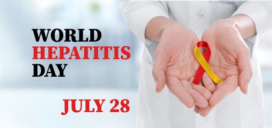 Image of 28th july World Hepatitis Day. Doctor holding yellow-red awareness ribbon on blurred background, closeup