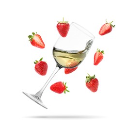 Image of Wine in glass and fresh strawberries falling against white background