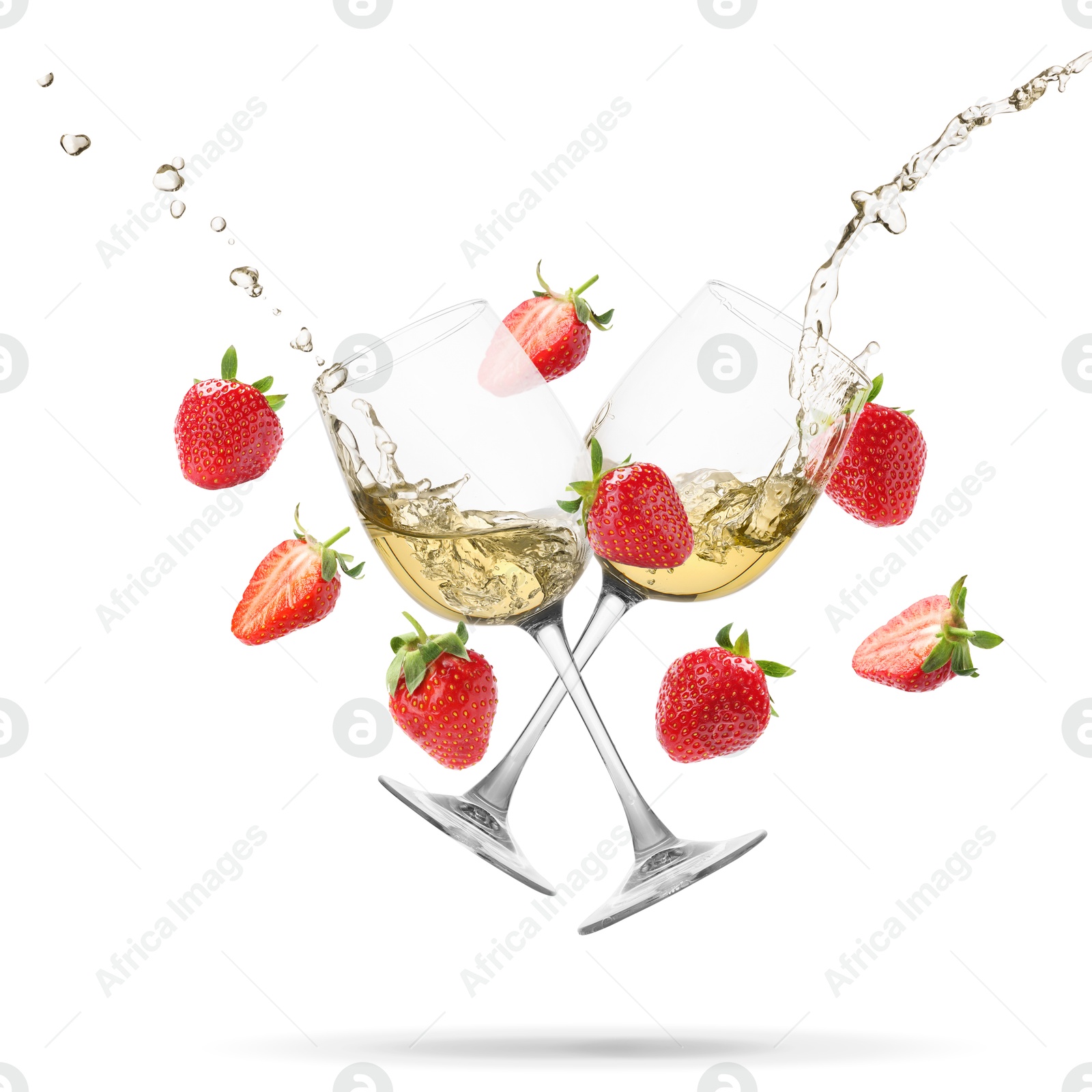 Image of Wine in glasses and fresh strawberries falling against white background