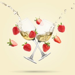 Image of Wine in glasses and fresh strawberries falling against beige background