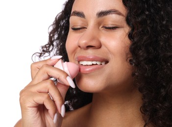 Photo of Smiling woman applying lip balm onto her lips on white background, closeup
