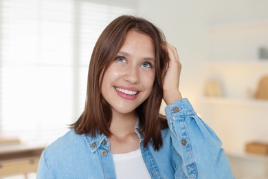 Photo of Portrait of smiling teenage girl at home