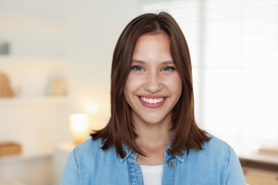Photo of Portrait of smiling teenage girl at home