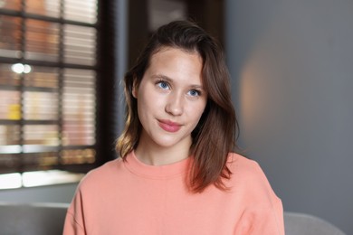Photo of Portrait of beautiful teenage girl at home