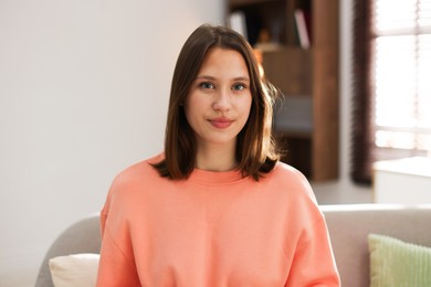 Photo of Portrait of beautiful teenage girl at home