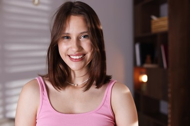Photo of Portrait of smiling teenage girl at home