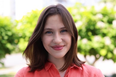 Photo of Portrait of beautiful teenage girl on city street