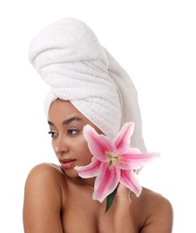 Photo of Portrait of beautiful Brazilian woman with lily flower after spa treatment on white background
