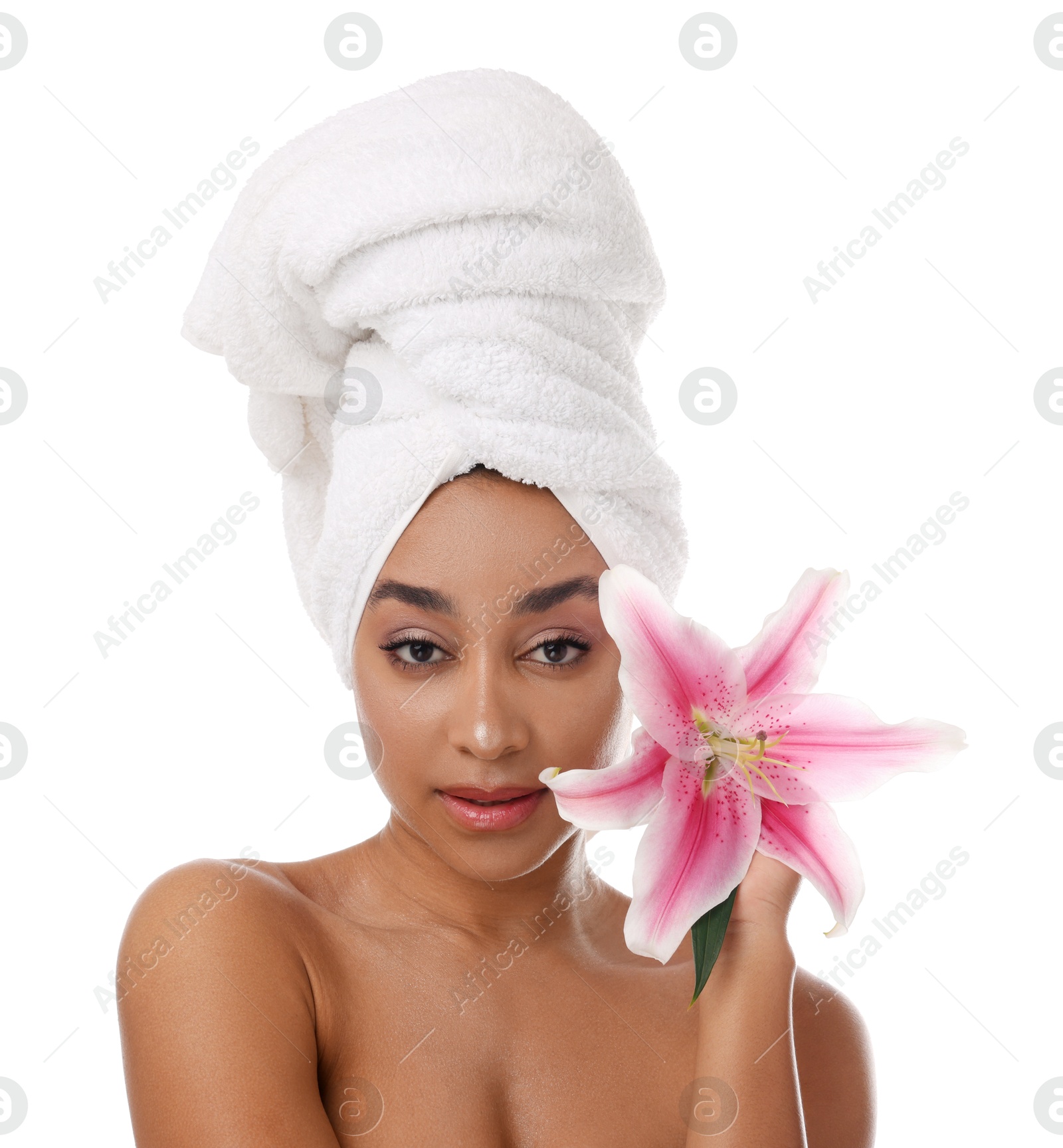 Portrait of beautiful Brazilian woman with lily flower after spa treatment on white background Photo of Portrait of beautiful Brazilian woman with lily flower after spa treatment on white background
