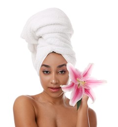 Photo of Portrait of beautiful Brazilian woman with lily flower after spa treatment on white background