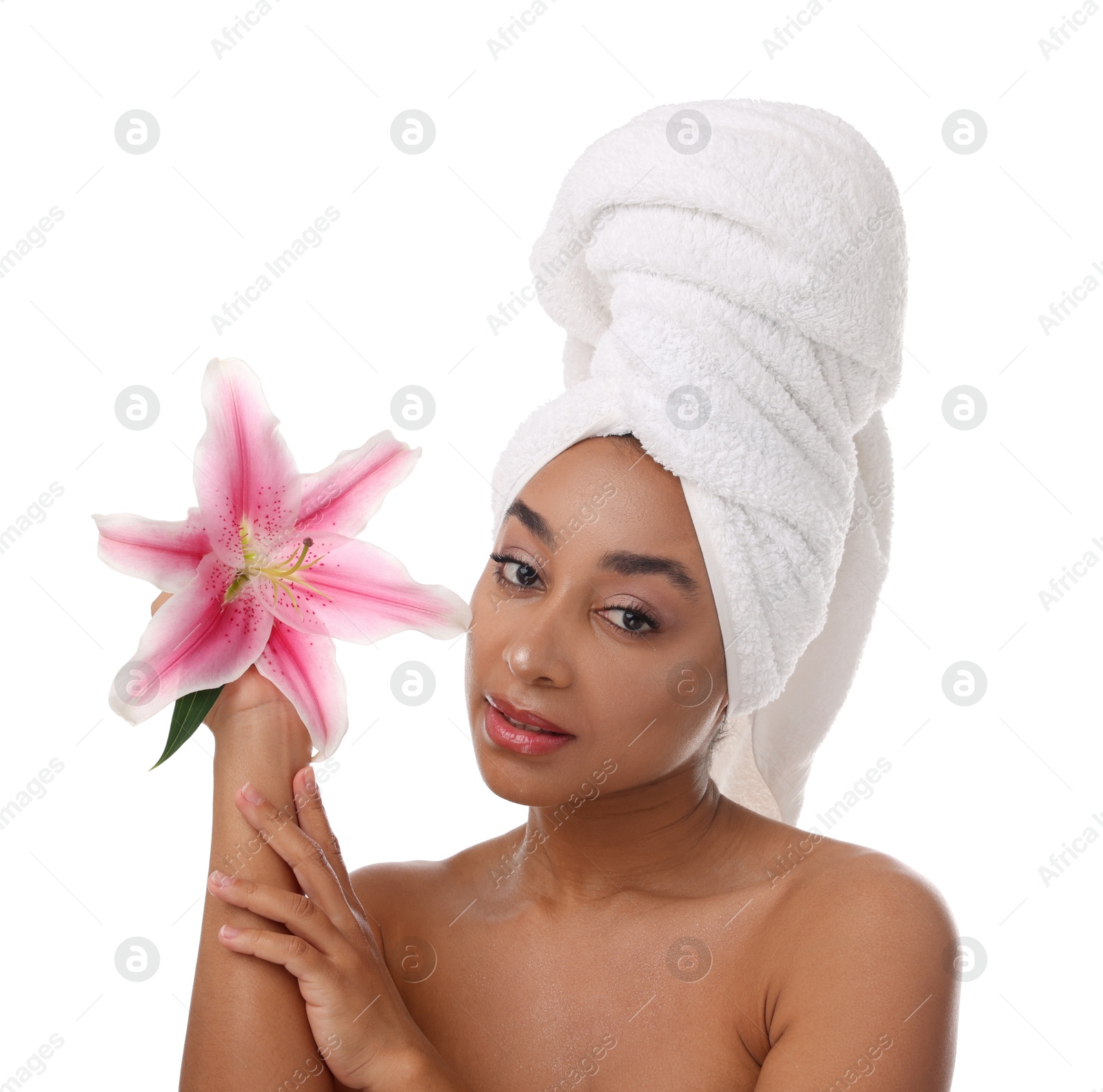 Portrait of beautiful Brazilian woman with lily flower after spa treatment on white background Photo of Portrait of beautiful Brazilian woman with lily flower after spa treatment on white background