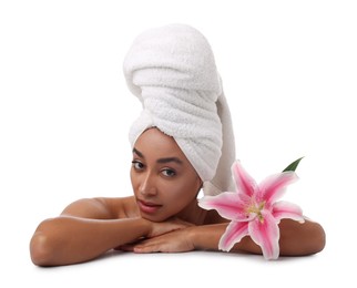 Photo of Portrait of beautiful Brazilian woman with lily flower after spa treatment on white background