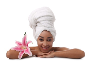 Photo of Portrait of beautiful Brazilian woman with lily flower after spa treatment on white background