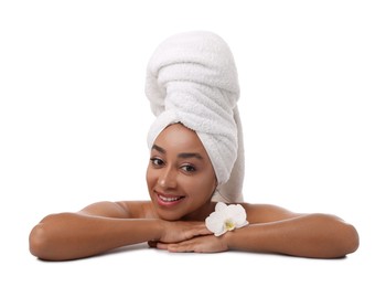 Photo of Portrait of beautiful Brazilian woman with orchid flower after spa treatment on white background