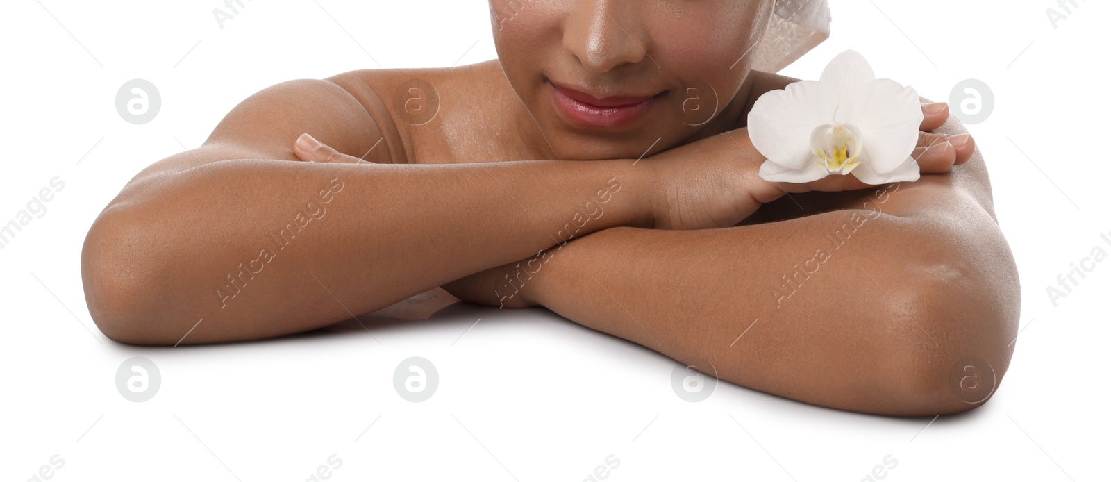 Photo of Brazilian woman with orchid flower after spa treatment on white background, closeup