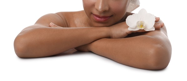 Photo of Brazilian woman with orchid flower after spa treatment on white background, closeup