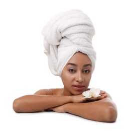 Photo of Portrait of beautiful Brazilian woman with orchid flower after spa treatment on white background