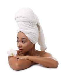 Photo of Portrait of beautiful Brazilian woman with orchid flower after spa treatment on white background