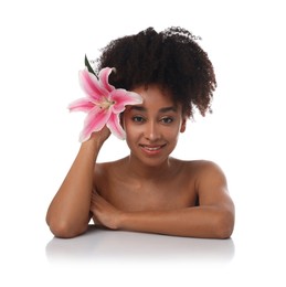 Photo of Portrait of beautiful Brazilian woman with lily flower after spa treatment on white background