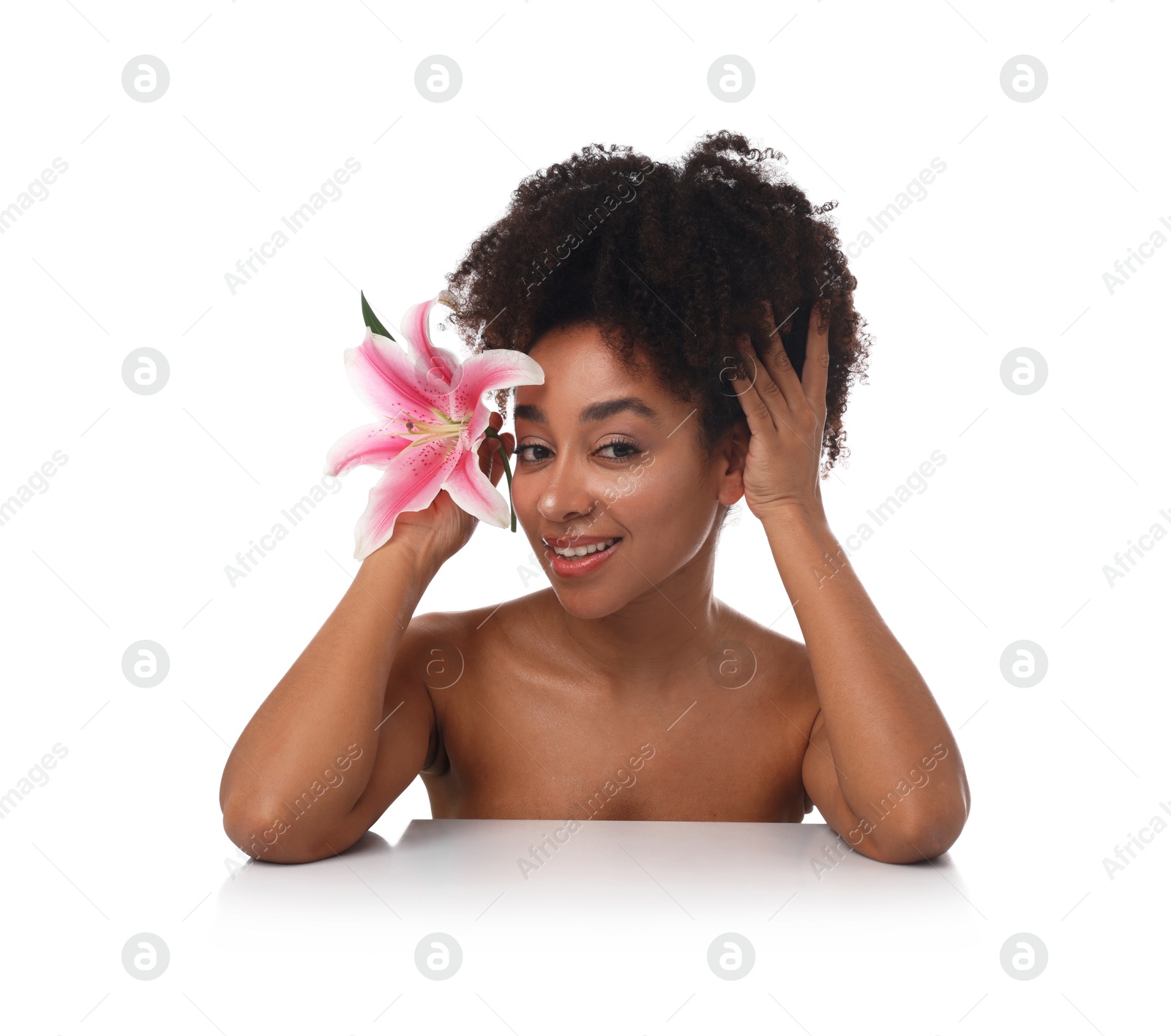Portrait of beautiful Brazilian woman with lily flower after spa treatment on white background Photo of Portrait of beautiful Brazilian woman with lily flower after spa treatment on white background