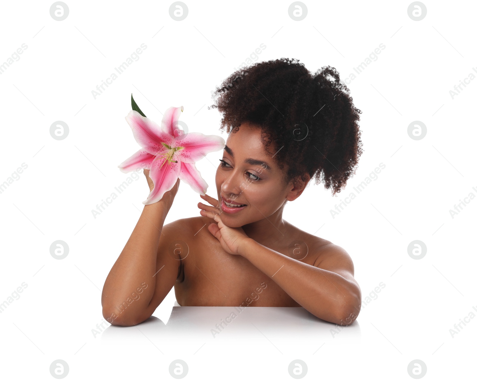 Portrait of beautiful Brazilian woman with lily flower after spa treatment on white background Photo of Portrait of beautiful Brazilian woman with lily flower after spa treatment on white background