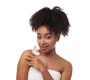 Photo of Portrait of beautiful Brazilian woman with orchid flower after spa treatment on white background