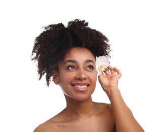 Photo of Portrait of beautiful Brazilian woman with orchid flower after spa treatment on white background