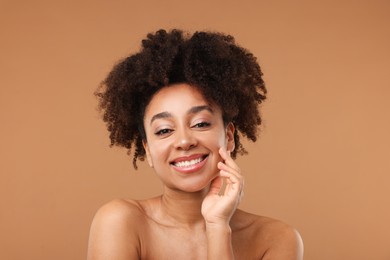 Photo of Portrait of beautiful Brazilian woman after spa treatment on light brown background