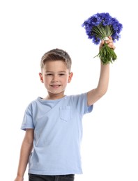 Photo of Smiling little boy with bouquet of beautiful cornflowers on white background