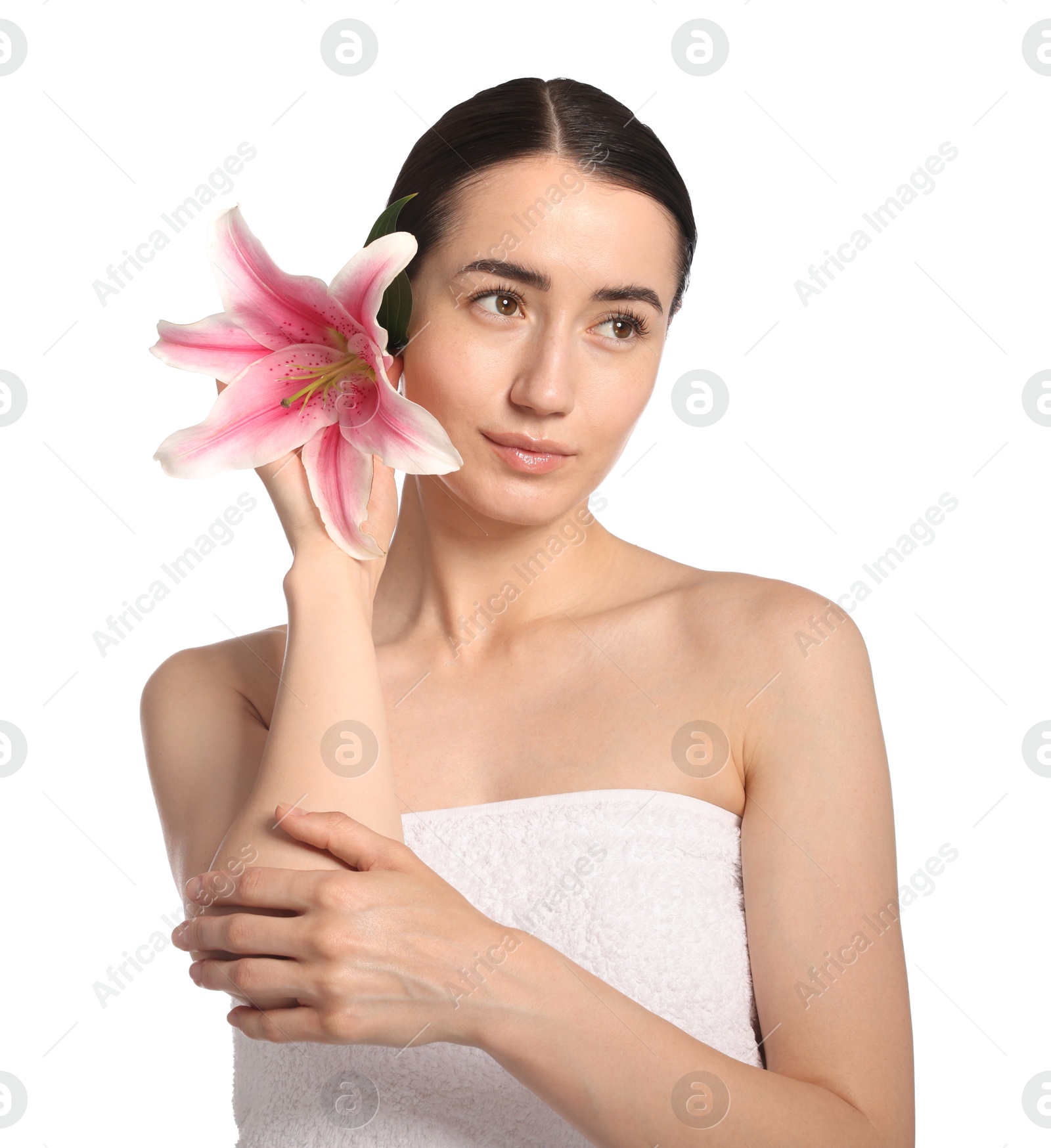 Photo of Beautiful woman with lily flower after spa treatment on white background